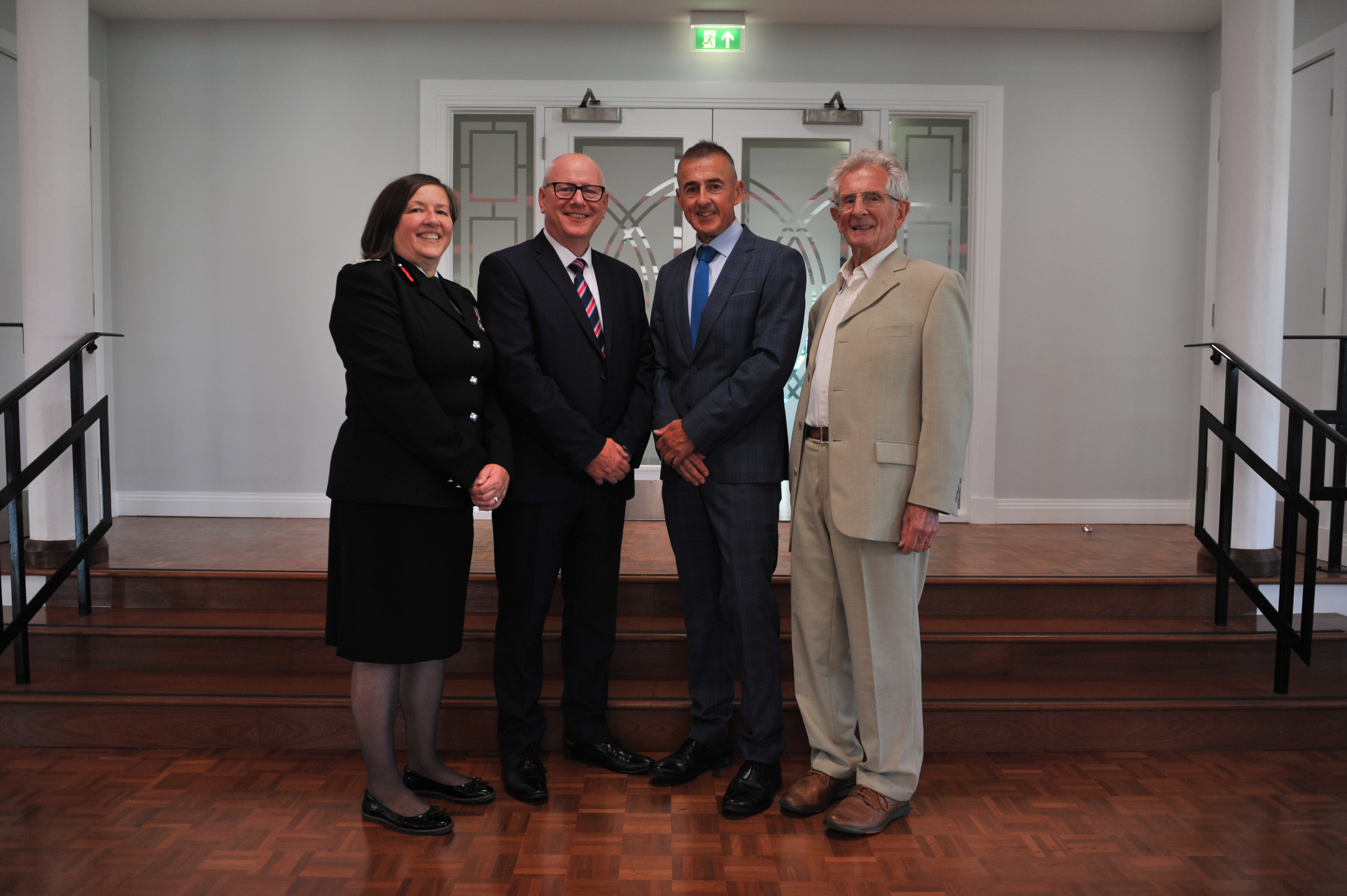 Previous CFO Eric Whitaker, previous Executive Support Officer Keith Ring and CFO Dawn Whittaker standing together indoors posing to camera at Saltdean Lido event.