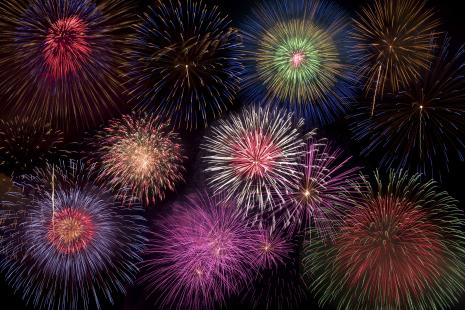 Fireworks exploding in dark sky