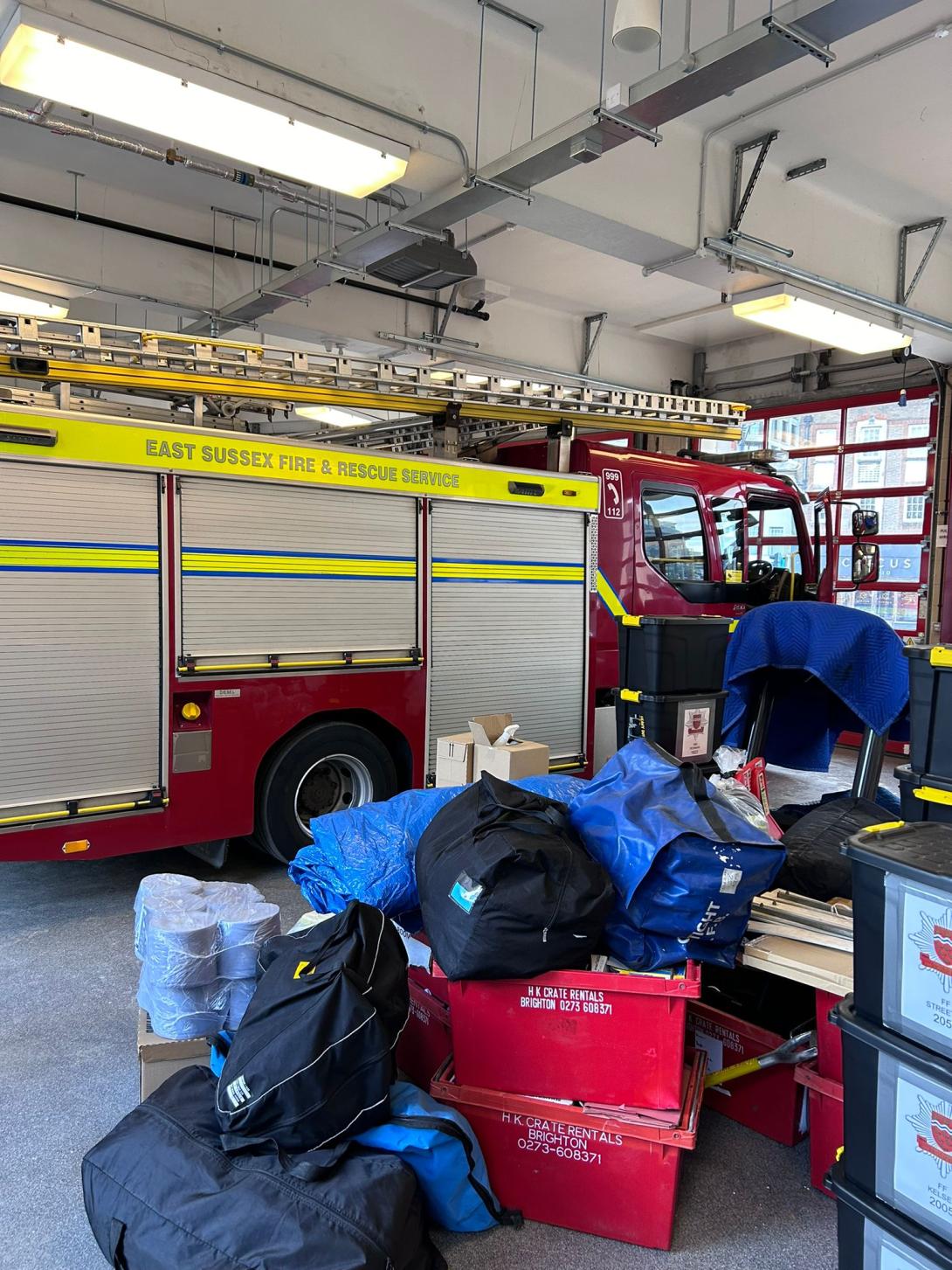 Fire appliance in bay at Preston Circus with moving in items